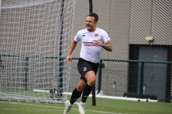 Ally Love celebrates after scoring for Clyde from the penalty spot against Annan to clinch promotion