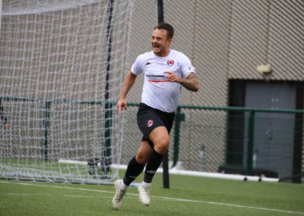 Ally Love celebrates after scoring for Clyde from the penalty spot against Annan to clinch promotion