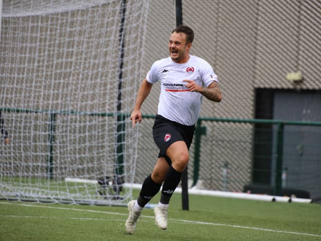 Ally Love celebrates after scoring for Clyde from the penalty spot against Annan to clinch promotion