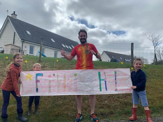 Richard (pictured with his family) is doing a 40 40 Challenge to raise money for Children with Cancer UK, Guide Dogs and Law and District AAC