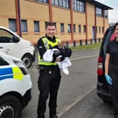 PC Robert Fox and Scottish SPCA senior animal rescue officer Jan Toraman with the rescued fox cub. (Photo: Scottish SPCA)