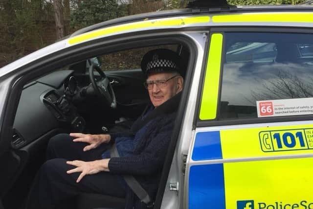 Percy Mann (102) enjoying a drive with the local police last year.