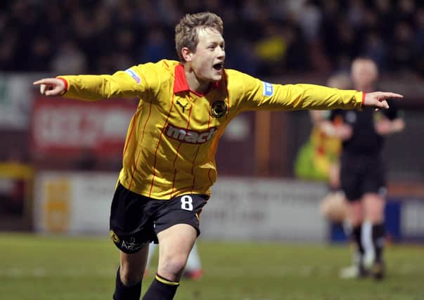James Craigen celebrates a goal during his time with Partick Thistle