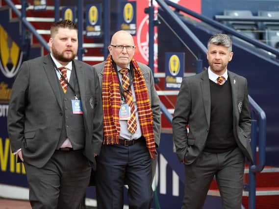 Jim McMahon (centre), pictured with Motherwell FC chief executive Alan Burrows and manager Stephen Robinson, has provided fans with update