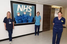 Featuring in the painting are, from left, anaesthetist Dr Kathryn Puxty, physiotherapist Helen Devine and senior charge nurse Suzi Madden.