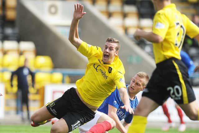 White takes a tumble playing for Livingston against Cowdenbeath in 2014 (Pic by Neil Hanna)