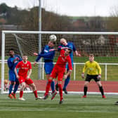 Carluke Rovers (wearing blue shirts) are due to play in Conference B of the West of Scotland League next season, while local rivals Lanark United (in red shirts)  will be in Conference C. (Library pic by Kevin Ramage)