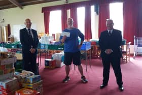 David Dempster (left), of Lodge Newton Mearns, and Stephen Hardy, of Lodge Nitshill, presented the donation to Pastor David Murray.