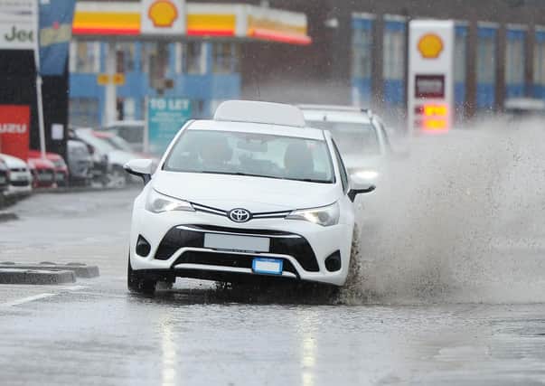 Heavy downpours are likely to cause localised flooding and difficult driving conditions.