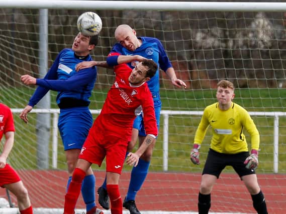 Lewis Hill (in red strip) in action for Lanark United last season (Pic by Kevin Ramage)