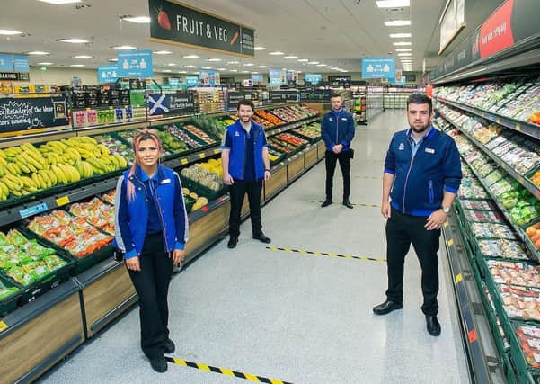 Aldi's new store at Crown Street Retail Park, Gorbals, Glasgow, from left, Stef Hume, Tom Welsh, Jordan Currie-McLean and store manager Matthew McGarvey.
