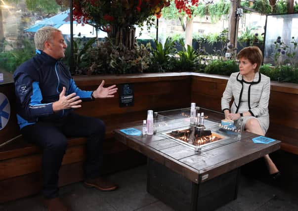 First Minister Nicola Sturgeon chats with Nic Wood during a visit to Cold Town House in Edinburgh, where she saw the changes in place to keep staff and customers safe in the outdoor hospitality industry. Photo by Andrew Milligan - Pool/Getty Images.