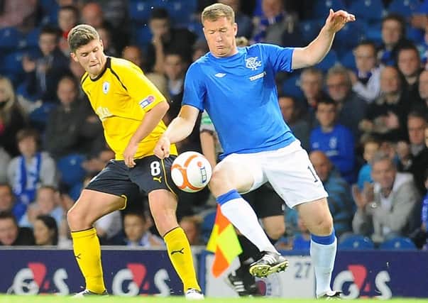 Kevin Kyle in action for Rangers during his footballing days.