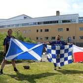 Dalziel aces (from left) holding flags are Brian Thompson, Andy McLaren and club captain Ross Mitchell.
