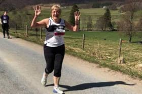 Margaret Allan celebrates finishing one of her 184 park runs, in Shetland last summer.