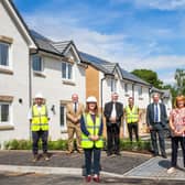 Representatives from Barrhead Housing Association and Taylor Wimpey in Neilston  for the hand over of the property. Pictures Copyright: Iain McLean.