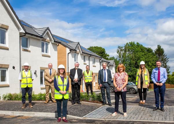 Representatives from Barrhead Housing Association and Taylor Wimpey in Neilston  for the hand over of the property.
 
Pictures Copyright: Iain McLean
.
