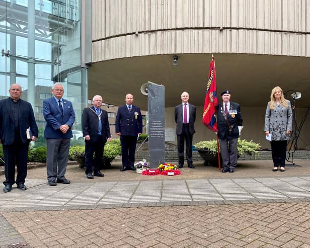 Pictured left to right are; Father Bill Bergin, Campbell Thomson (Lanarkshire Yeomanry), Depute Provost Tom Castles, Councillor David Cullen, Lady Haughey, John McConnell (Veteran Lanarkshire Royal Engineers) and Robert Steenson (Executive Director NLC).