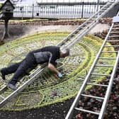 Work takes place earlier this year on the famous Princes Street floral clock in Edinburgh, which for its theme in 2020 thanks NHS staff and keyworkers. Photo: Lisa Ferguson