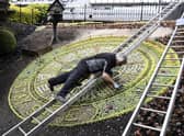 Work takes place earlier this year on the famous Princes Street floral clock in Edinburgh, which for its theme in 2020 thanks NHS staff and keyworkers. Photo: Lisa Ferguson