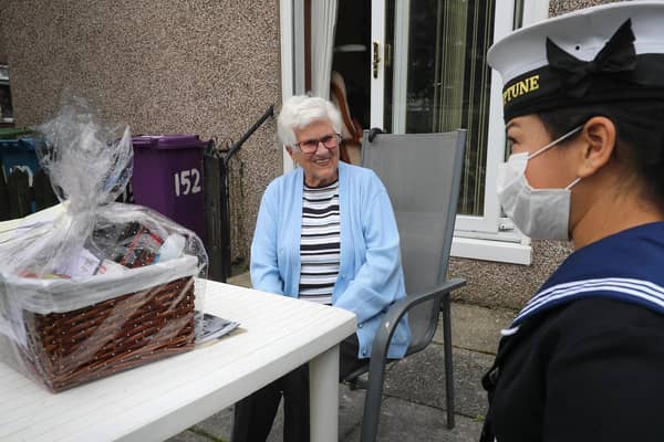 Roxanne Castellas chats to WWII Veteran Mrs Margaret Millar at her home in Glasgow. (Photo: Royal Navy