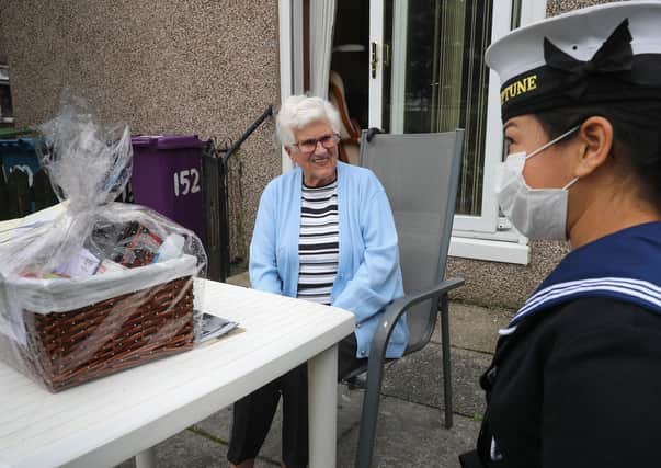 Roxanne Castellas chats to WWII Veteran Mrs Margaret Millar at her home in Glasgow. (Photo: Royal Navy