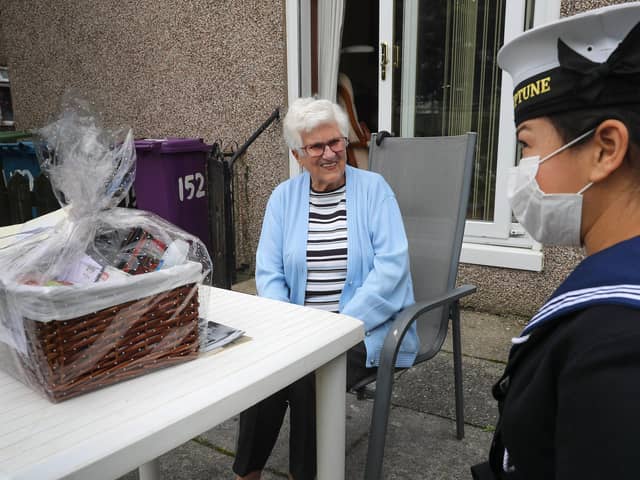 Roxanne Castellas chats to WWII Veteran Mrs Margaret Millar at her home in Glasgow. (Photo: Royal Navy