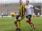 David Goodwillie in action against Dumbarton in Clyde's last match before lockdown