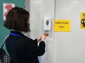 The Scottish government has said facemasks should be worn by adults and pupils in secondary school while they are in corridors and communal areas where physical distancing is difficult to maintain