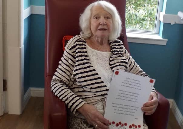 Isabella ‘Belle’ McCreadie from Barrhead with a copy of her poem, written to convey her emotions on the 75th anniversary of VJ Day