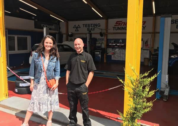 Jennifer Reoch with Paul Martin of C&M Motors, Barrhead, to promote East Renfrewshire Council’s Shop Local campaign