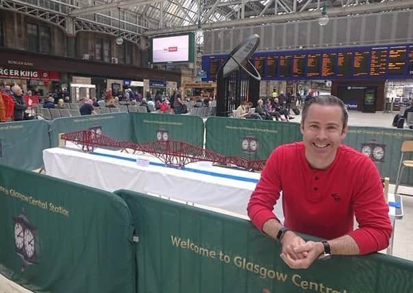 Michael Dineen with his Forth Bridge Lego model at Glasgow's Central Station where he was filmed for the BBC Scotland series 'Inside Central Station'.