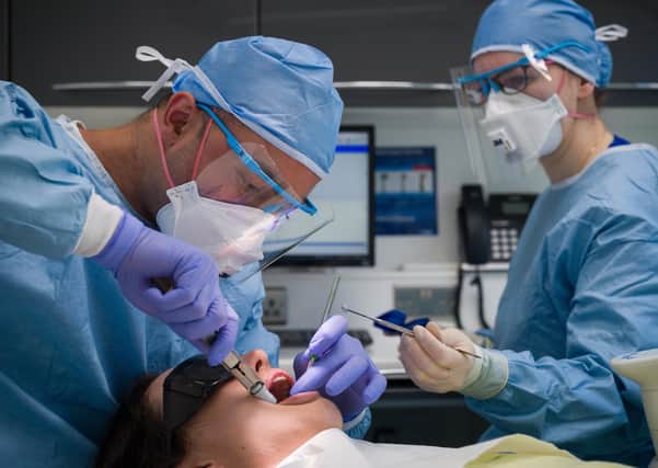Some emergency dental work was carried out during the lockdown by dentists and staff had to wear full PPE. Photo by Leon Neal/Getty Images