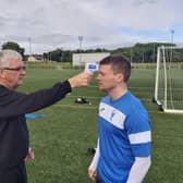 Craig Martin does a temperature check on Lanark United ace James Martin (Pic courtesy of Lanark United)