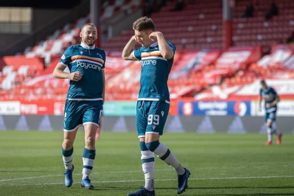 Allan Campbell (left) celebrates with Chris Long after Long had put ’Well 2-0 up at Pittodrie (pic by David Cowe)