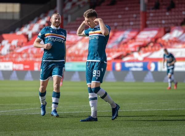 Allan Campbell (left) celebrates with Chris Long after Long had put ’Well 2-0 up at Pittodrie (pic by David Cowe)