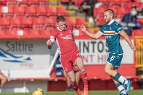 Allan Campbell (right) jostles with Aberdeen star Jonny Hayes at Pittodrie on Sunday (Pic by David Cowe)