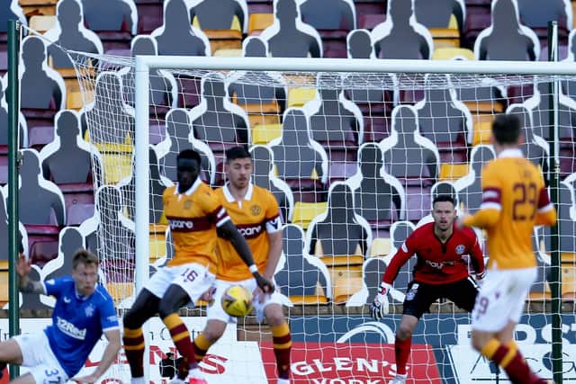 The ball strikes Bevis Mugabi’s arm, leading to the concession of the first penalty in Motherwell’s 5-1 defeat by Rangers (Pic by Ian McFadyen)