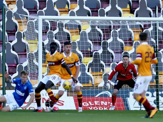 The ball strikes Bevis Mugabi’s arm, leading to the concession of the first penalty in Motherwell’s 5-1 defeat by Rangers (Pic by Ian McFadyen)