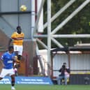 Bevis Mugabi beats Alfredo Morelos in the air (Pic by Ian McFadyen)