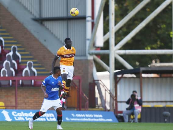 Bevis Mugabi beats Alfredo Morelos in the air (Pic by Ian McFadyen)