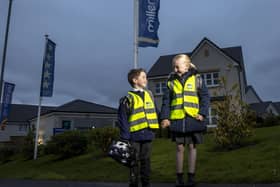 Pictured from left to right Evie Downs (7) and Jake Pentland (5) are the first to try out their new high vis vests from Miller Homes as part of the house builder’s Home Safe campaign