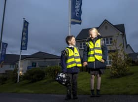 Pictured from left to right Evie Downs (7) and Jake Pentland (5) are the first to try out their new high vis vests from Miller Homes as part of the house builder’s Home Safe campaign