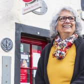 Nazra Alam outside Sanquhar Post Office, which opened its doors in 1712. Pic: SWNS