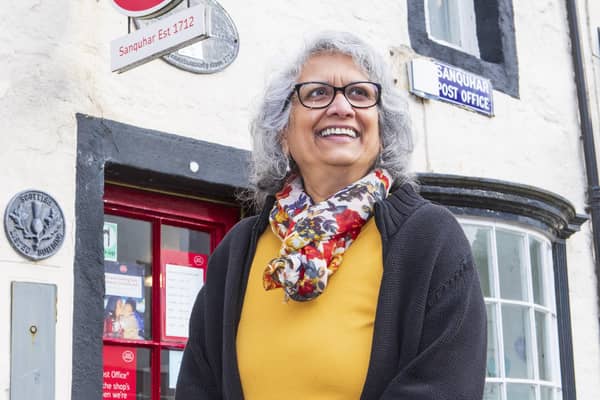 Nazra Alam outside Sanquhar Post Office, which opened its doors in 1712. Pic: SWNS