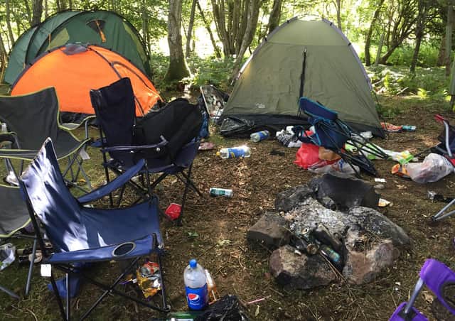 Dirty campers...have strewn the countryside with their discarded rubbish, leaving sites like this for land managers and their staff to clean up.