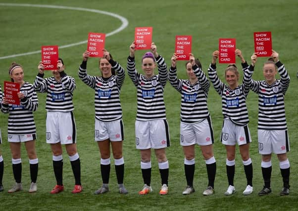 Queen’s Park players Show Racism the Red Card prior to kick off (Photo: Ian Cairns)
