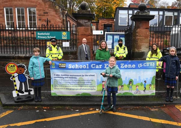 Councillor Anna Richardson (centre) with Battlefield Primary School Head Teacher, Alan Shields, police officers from Glasgow South East, Holly Coyne, road safety officer, and pupils from Battlefield Primary School.
