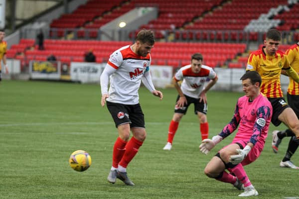 Partick Thistle keeper Jamie Sneddon saves from David Goodwillie (pic: CraigBlackPhotography.com)