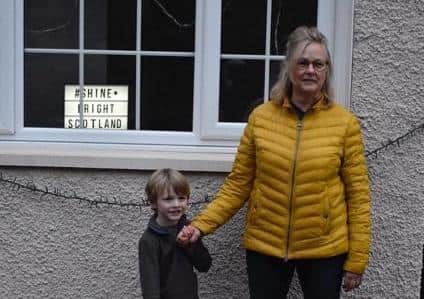 Shine Bright Scotland...campaign was launched by Alison Johnston, who received a helping hand from her grandson Dougal MacAllister (5).